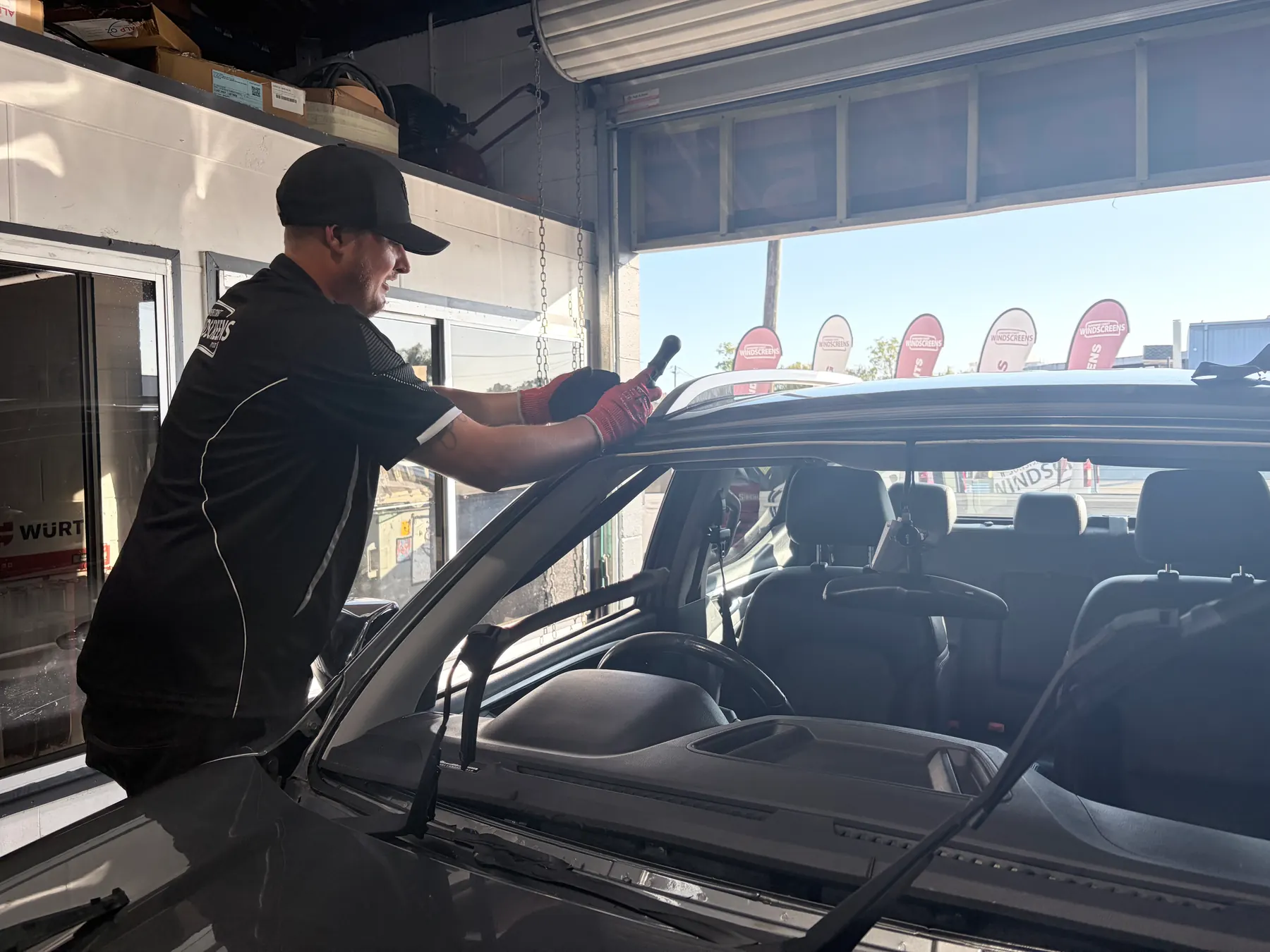 A Sunshine Coast Windscreens technician priming the pinch-weld before fitting a new windscreen